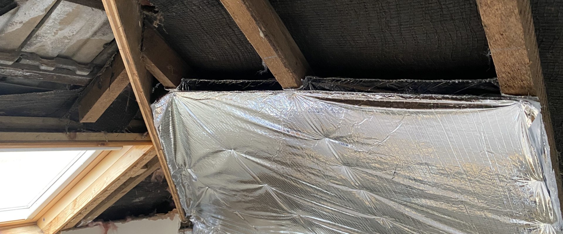 Can insulation touch rafters?