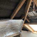 Can insulation touch rafters?