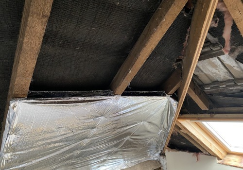 Can insulation touch rafters?